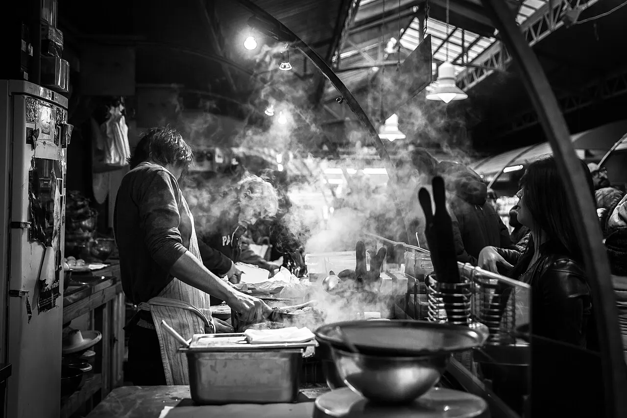 Staff preparing food in a working restaurant kitchen