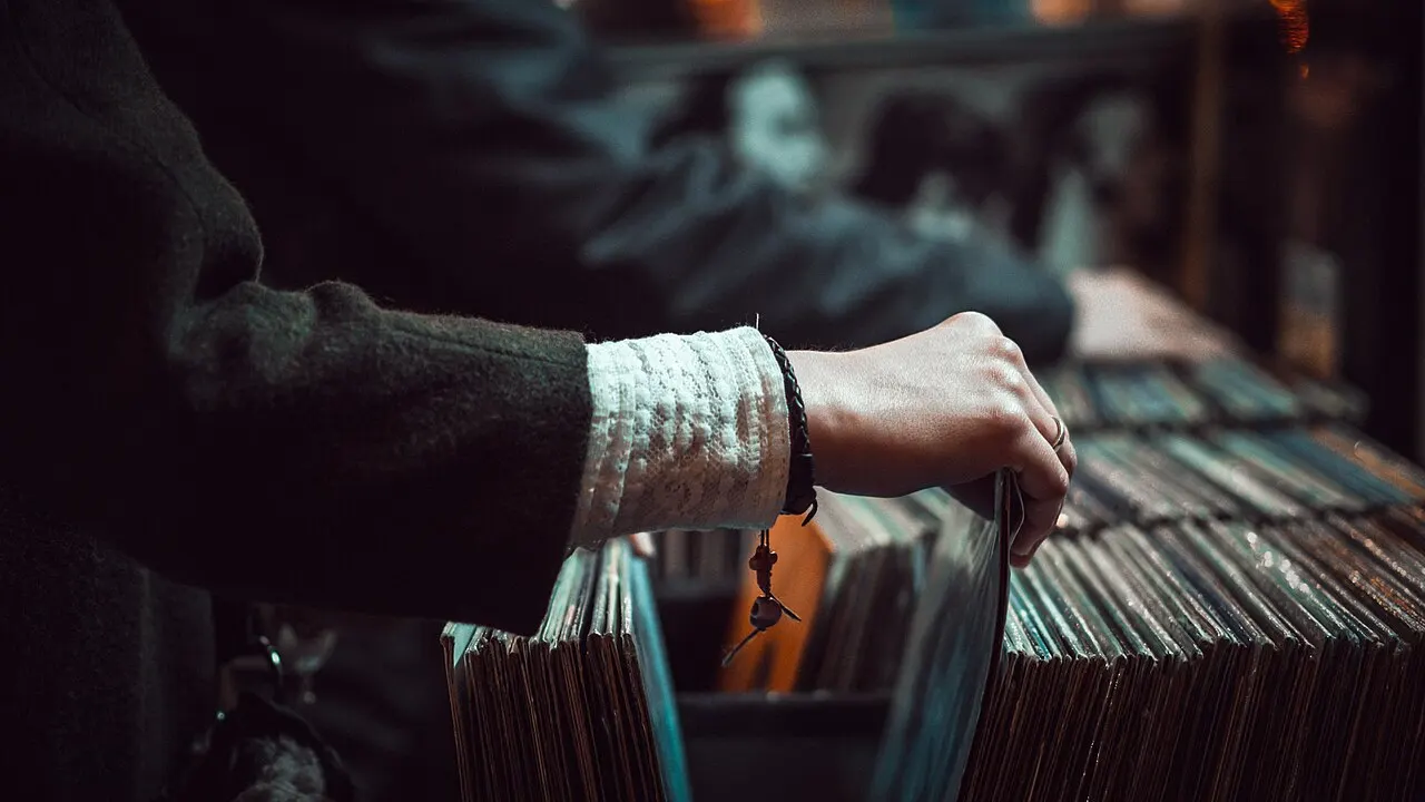 Customer browsing shelves in a small retail shop